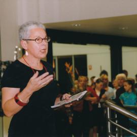 Unidentified person speaking at a Central Coast Campus art exhibition [n.d.].