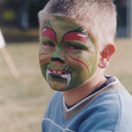Unidentified boy with his face painted at the Central Coast Campus Open Day, 4th June 2000.
