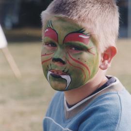 Unidentified boy with his face painted at the Central Coast Campus Open Day, 4th June 2000.