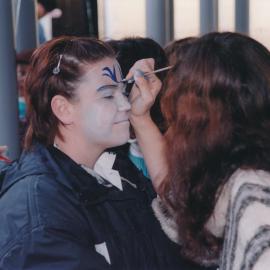 Unidentified girl having her face painted at the Central Coast Campus Community Open Day, 4th June 2000.