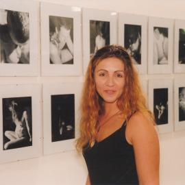 Jennifer Dias with her work at a Central Coast Campus art exhibition.
