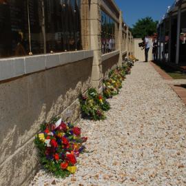 Floral tributes at the memorial service at the Jim Comerford Miners Memorial Wall, Aberdare, NSW, 22 September 2013