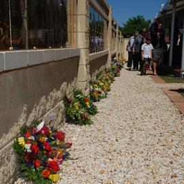 Floral tributes at the memorial service at the Jim Comerford Miners Memorial Wall, Aberdare, NSW, 22 September 2013