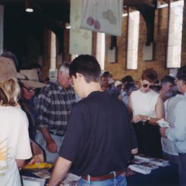 [unidentified people] representing the Central Coast Campus at an open day with unidentified members of the public [n.d.] [unknown location]