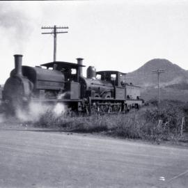 AIS, Locomotive "Mount Kembla", hauling Locomotive "Gladstone", Port Kembla, NSW [c.1930s]