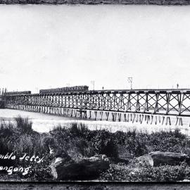 Southern Coal Co. Ltd, first load of coal being loaded into ship at the Mount Kembla coal and oil jetty, Port Kembla, NSW, [1883]