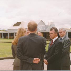 Brendan Nelson talking to 2 unknown person outside the library with Barry McKnight and Les Eastcott