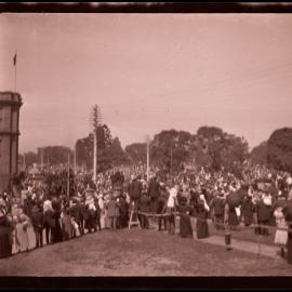 Public gathering at Hyde Park, Australian Museum on left at corner of Park and College Streets, Sydney NSW