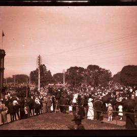 Public gathering at Hyde Park, Australian Museum on left at corner of Park and College Streets, Sydney NSW