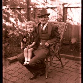 Thomas Rodoni (Jnr) or Jim Rodoni with unidentified elderly man seated in garden