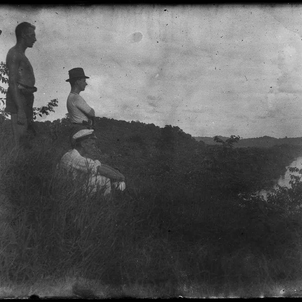Sepik River, New Guinea. Commander C.L. Cumberlege, Royal Australian Navy, and two companions surveying the river from the 300 foot Timbunke lookout, December 1914
