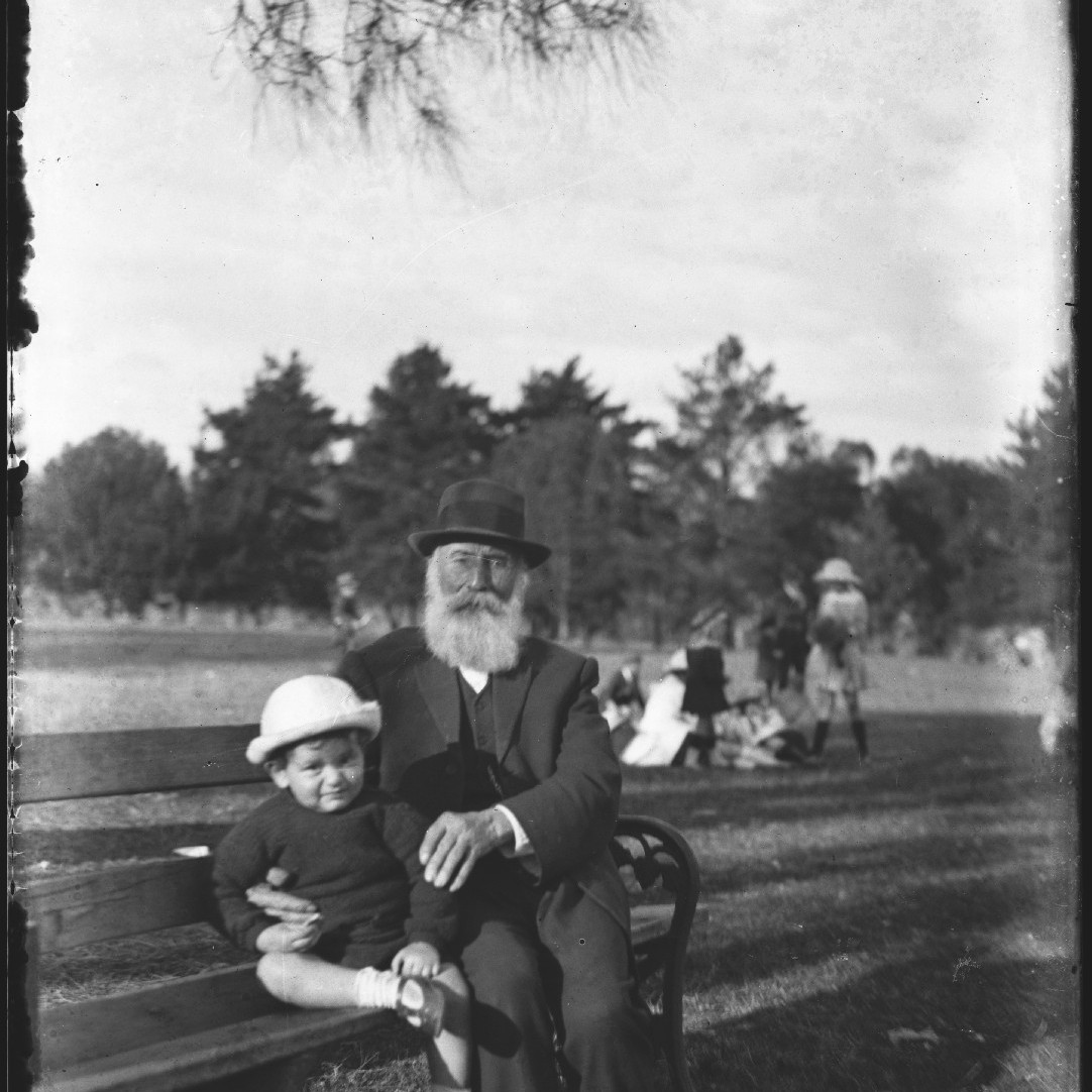 Thomas Rodoni (Jnr) and possibly his grandfather sitting on park bench, c1910s