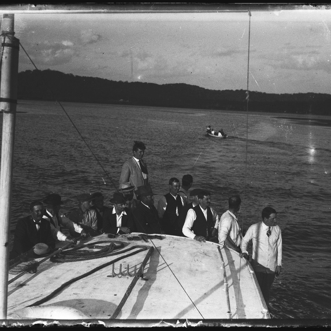 Group of men on a boat in river, c. 1910s