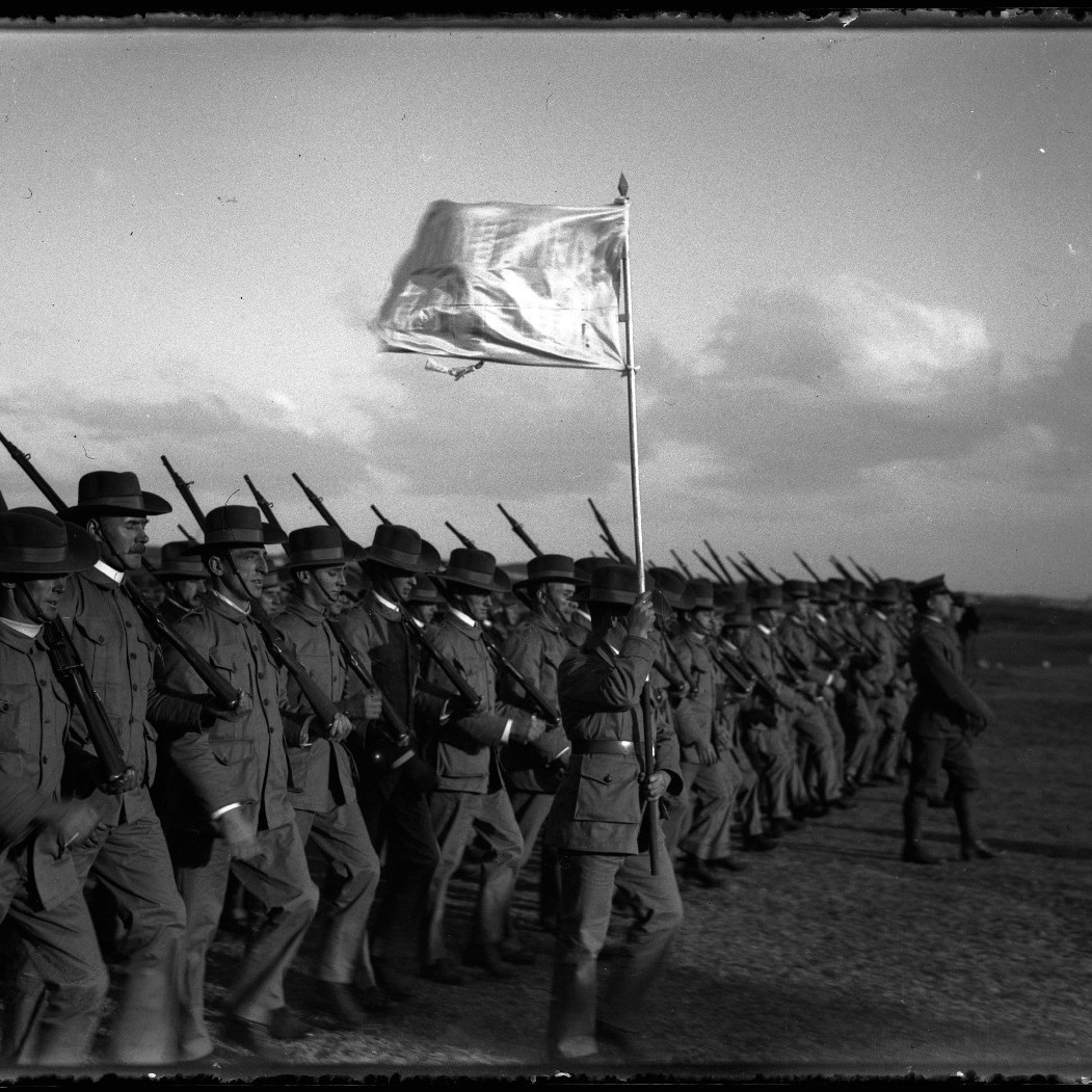 Soldiers marching under Leichhardt flag, possibly during training at Holsworthy military reserve near Liverpool, NSW in 1914.