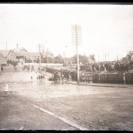 People gathered in Railway Terrace (now Railway Street), Petersham watching aftermath of accident with horse and cart, in proximity Carrington Hotel (now the White Cockatoo Hotel), Petersham Girls High School in background, Sydney, 9 March 1913.