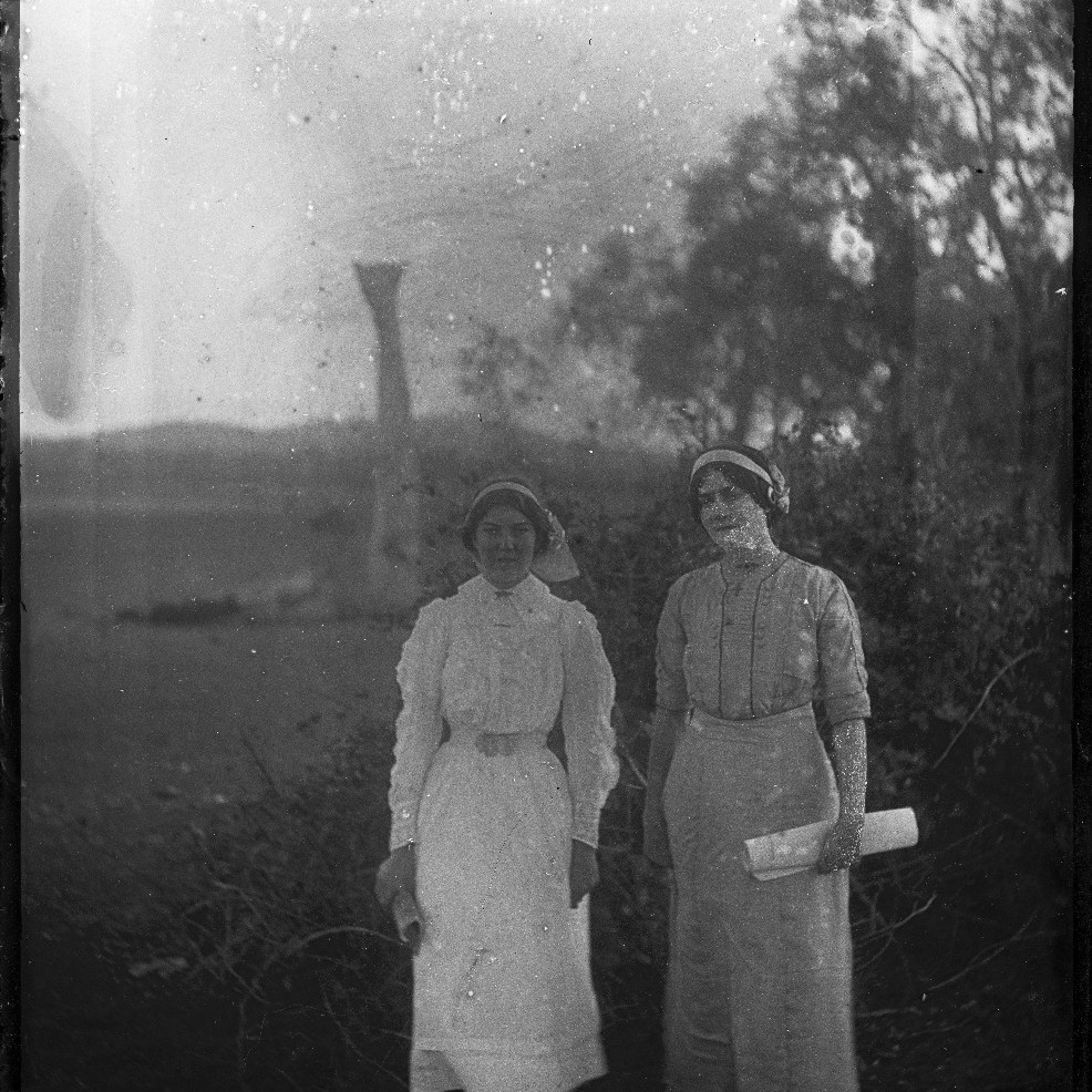 Two women in field, Catherine Annie Rodoni (nee Wilson) on right