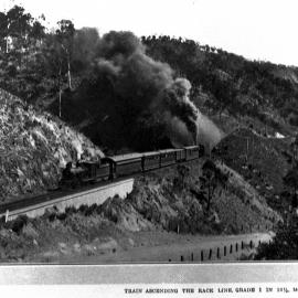 QGR, PB-15 Class hauling passenger with assistance being provided by an Abt-Type Steam Locomotive, up the 1 in 16.5 Gradient on the Mount Morgan Line, [1920s]