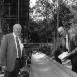 Professor Alan Roberts with an unidentified gentleman inspects the bulkmat conveyor belt, the University of Newcastle, Australia