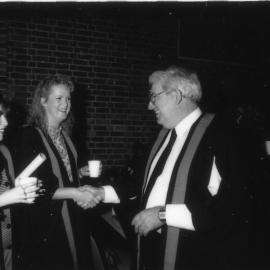 Three unidentified people at a graduation ceremony,  the University of Newcastle, Australia - c.9 May, 1992