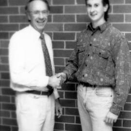 Professor Adrian Page congratulates an unidentified student, the University of Newcastle, Australia - April, 1992
