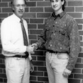 Professor Adrian Page congratulates an unidentified student, the University of Newcastle, Australia - April, 1992