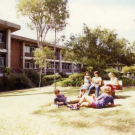 Students relax outside the McMullin Building, the University of Newcastle, Australia