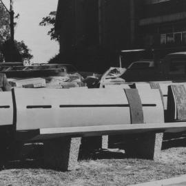 Mr. John Armstrong sitting outside the McMullin building, the University of Newcastle, Australia