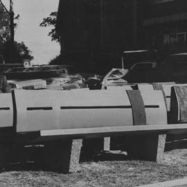 Mr. John Armstrong sitting outside the McMullin building, the University of Newcastle, Australia