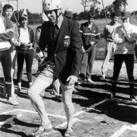 Professor Godfrey Tanner with members from the University of Newcastle Baseball Club on Comsteel Oval, Australia