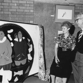 Professor Peter Hendry with an unidentified woman looking at art, the University of Newcastle, Australia