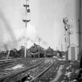 NSWGR C35 Class 4-6-0 Type express passenger locomotive on up "Caves Express" overtakes stationary goods train at Katoomba, [1930s]