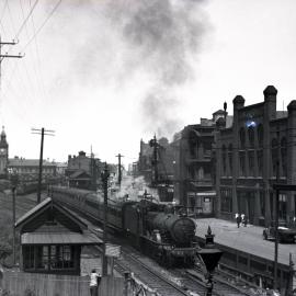 NSWGR C34 Class No. 3404 4-6-0 Type express passenger locomotive on passenger departing Newcastle, [1930]