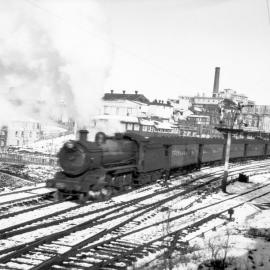 NSWGR C35 Class No. 3516 4-6-0 Type express passenger locomotive hauling an up passenger departing Katoomba, [1930s]