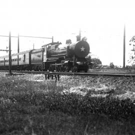NSWGR C35 Class No. 3506 4-6-0 Type express passenger locomotive hauling the "Caves Express", Lidcombe, [1930s]
