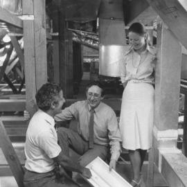 Mr Neil Pettigrew demonstrating to Mr Bob Cowdroy and Ms Katrina Nilsen how fluorescent tubes are changed, the University of Newcastle, Australia