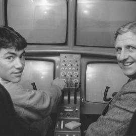 Mr. Sean Mandile (left) and Captain Barr (right) in the simulator in the Institute of Aviation Studio, the University of Newcastle, Australia - 1988