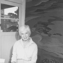 Artist Mary Beeston with her tapestry which hangs in The Great Hall at the University of Newcastle, Australia