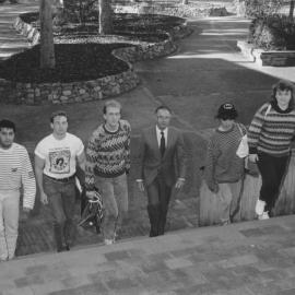 Professor Ken Dutton and Colin Goodger (3rd from left) with unidentified students on the Auchmuty Library steps, the University of Newcastle, Australia
