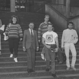 Professor Ken Dutton and Colin Goodger (3rd from right) with unidentified students on the Auchmuty Library steps, the University of Newcastle, Australia
