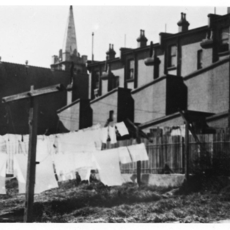 Clothes hanging on the line near the corner of Church and Watt Streets, Newcastle, NSW, 1938