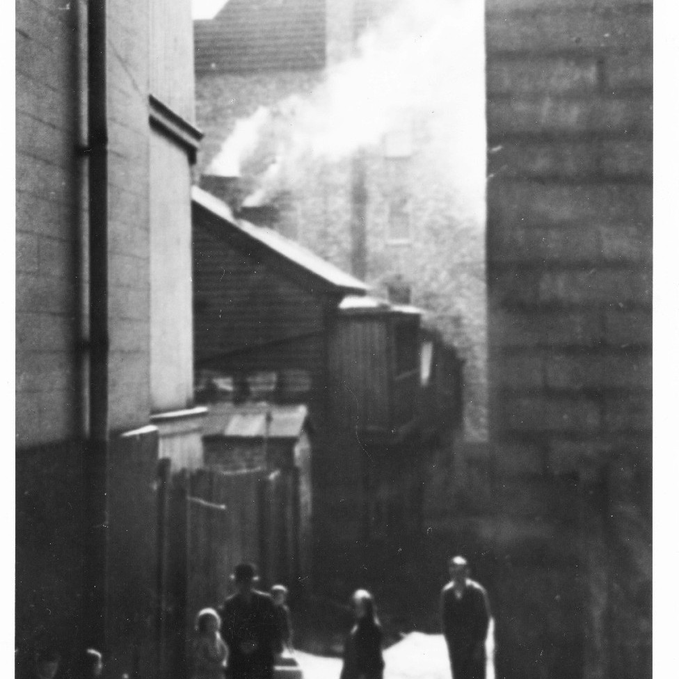 View of buildings on Church Street, Newcastle, NSW, down the lane towards Segenhoe Flats, 1938 