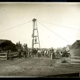 Workmen with pile driver, unidentified pit, 27 May 1898