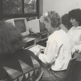 The Department of Management assists local schools. (L-R): Melissa McEwan, Fiona McVey, Dr. Joan Cooper and Domenica Bagnato, Newcastle, Australia - 1987