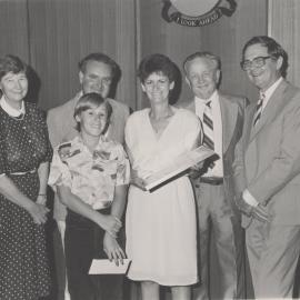Vice-Chancellor Don George (right) with Professor Beryl Nashar (left) presents certificates to an unidentified group of people, the University of Newcastle, Australia