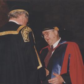 Chancellor Ric Charlton presents John Burgess with his doctorate degree at the Faculty of Engineering graduation ceremony, the University of Newcastle, Australia - 16 May 1997, 10.30am