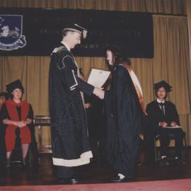 Vice-Chancellor Keith Morgan presents a Korean graduate with her award, the University of Newcastle - 1 November 1992