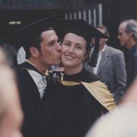 Two graduates celebrating after the Faculty of Law and Commerce graduation ceremony, the University of Newcastle, Australia - 2 May 1997, 2.30pm