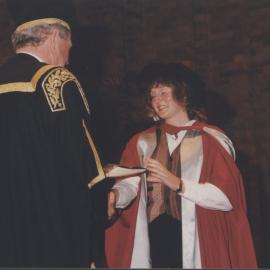 Chancellor Ric Charlton congratulates a graduate at the Faculty of Science / Maths graduation ceremony, the University of Newcastle, Australia - 9 May 1997, 6pm