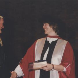 Chancellor Ric Charlton congratulates a graduate at the Faculty of Science / Maths graduation ceremony, the University of Newcastle, Australia - 9 May 1997, 6pm
