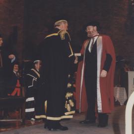 Chancellor Ric Charlton congratulates a graduate at the Faculty of Science / Maths graduation ceremony, the University of Newcastle, Australia - 9 May 1997, 6pm